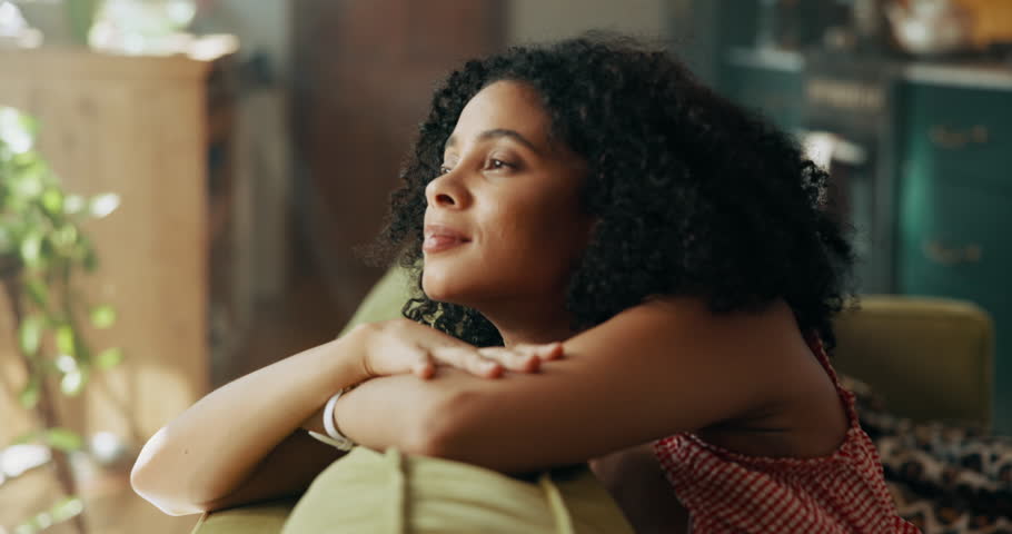 Happy, thinking and woman relax on sofa with ideas, inspiration and daydreaming in home. House, morning and African person in living room with reflection, planning day and thoughtful on weekend