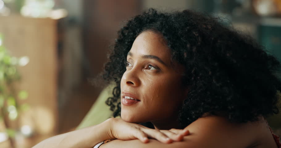 Happy, thinking and woman relax on sofa with ideas, inspiration and daydreaming in home. House, morning and African person in living room with reflection, planning day and thoughtful on weekend