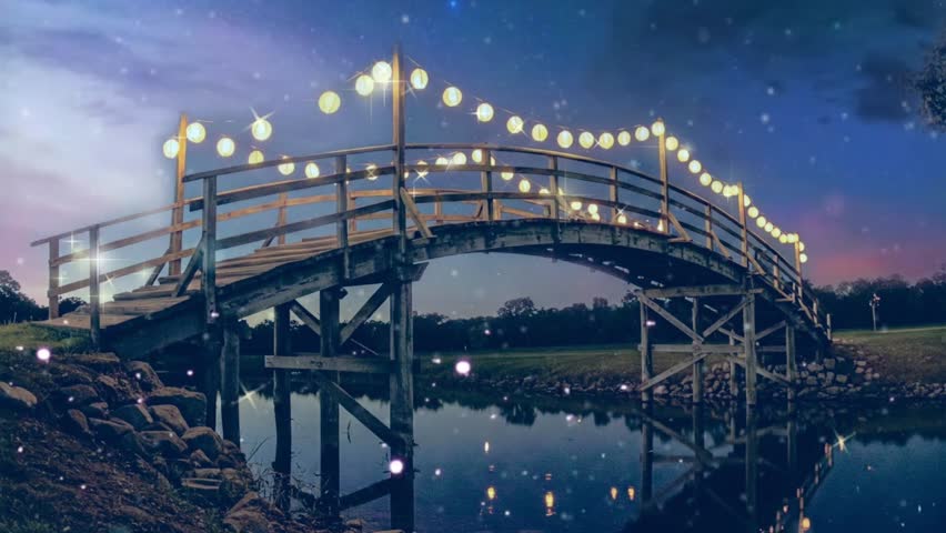 A traditional bridge over the river with many lit lanterns and a beautiful night sky. Fireflies decorate the darkness of the night