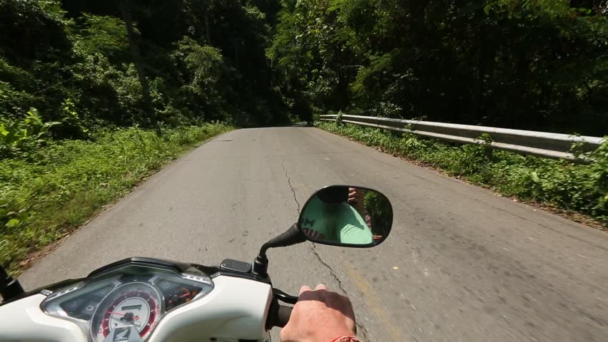 Riding a motorbike on mountain road Ko Chang island, Thailand (HD)