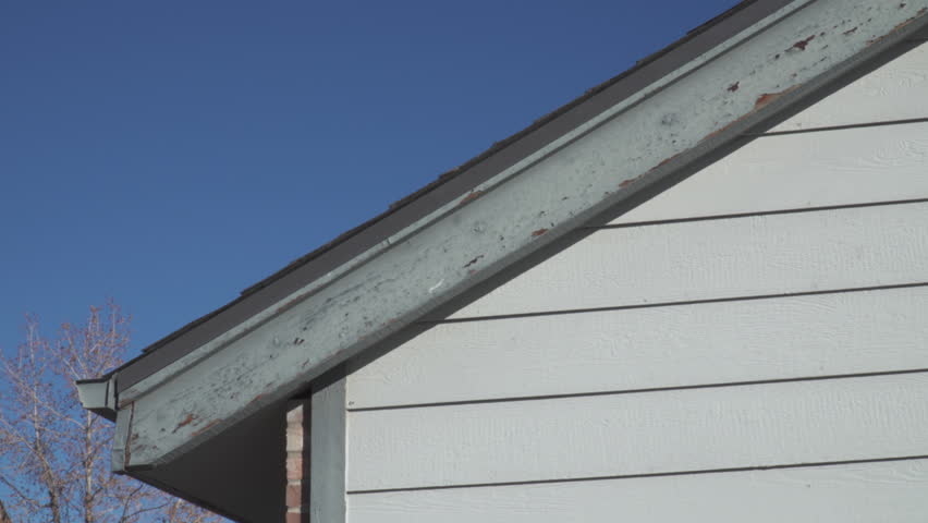 Apartment Building Chipped Paint and Rotting Wood Damage
