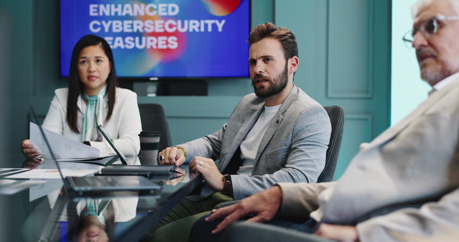 Presentation, meeting and business people in office for cybersecurity training, workshop and info. Professional, corporate and workers with monitor for data protection, digital security and safety