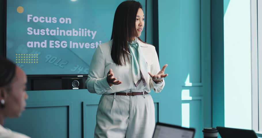 Presentation, meeting and businesswoman in office with team for sustainability and ESG investing. Discussion, screen and company speaker with bankers for financial proposal with investment plan.