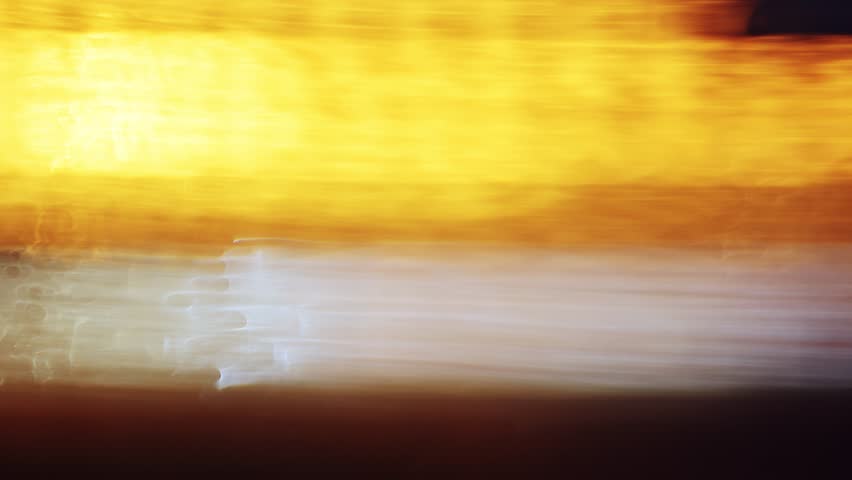 Drunk driving under influence concept, defocused blur footage of street and traffic light bokeh at night, 4K handheld footage