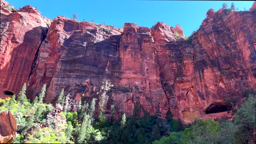 Scenic red rock formations in Zion National Park, Utah, USA, filmed on a sunny day