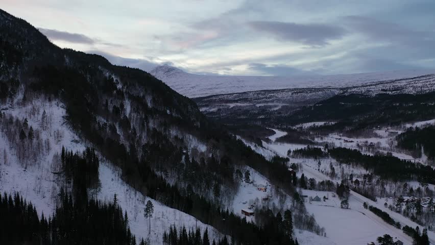 Discover breathtaking aerial views featuring snowy peaks, frozen landscapes, and serene beauty inside northern Norway’s enchanting Arctic Circle, filmed in crisp 4K quality.