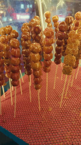 A traditional Chinese snack of candied fruit skewers on display in Wuzhen, China