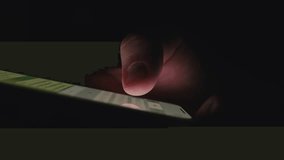 Close-up macro hands of a man scroll news feed on mobile phone app application. Screen of the mobile phone illuminates male hand.  - Powered by Shutterstock - Get 15% off with code: PIKWIZARD15