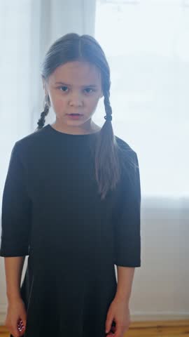 Dynamic and Highly Expressive Poses of a Young Girl Dressed in a Beautiful Elegant Black Dress