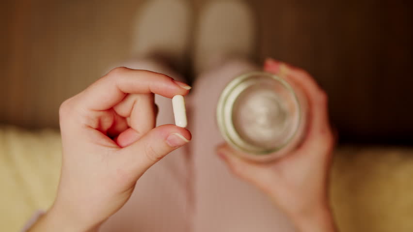 Pills and vitamins macro, Close up view of womans hands holding plenty of different drugs. Painkillers and antibiotics. Healthcare and medicine concept