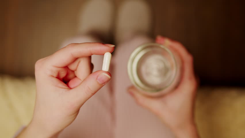 Pills and vitamins macro, Close up view of womans hands holding plenty of different drugs. Painkillers and antibiotics. Healthcare and medicine concept