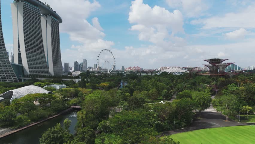 Supertree Grove, Marina Bay Sands, Singapore Flyer From Gardens by the Bay In Singapore. - aerial ascend shot