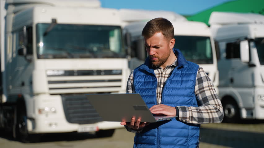 Warehouse worker monitoring truck loading process - Powered by Shutterstock - Get 15% off with code: PIKWIZARD15