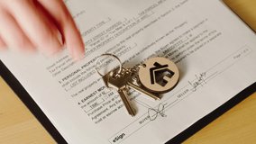 Customer signing contract top view, real estate agent giving home keys close-up, professional realtor. Buying flat apartment, property purchasing. Moving to new house, housing service concept. - Powered by Shutterstock - Get 15% off with code: PIKWIZARD15