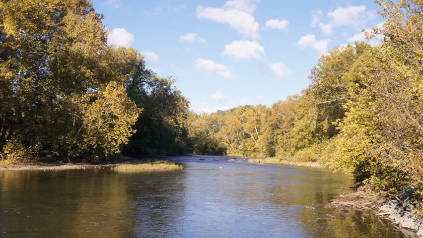 Calm rural river during autumn surrounded by the Shenandoah Mountains. North Fork of the Shenandoah River.