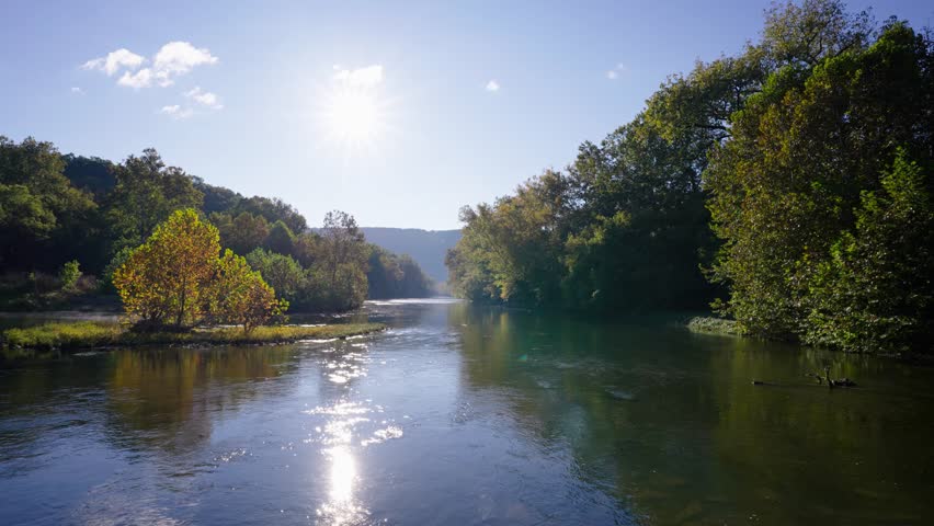 Calm rural river during autumn surrounded by the Shenandoah Mountains. North Fork of the Shenandoah River.