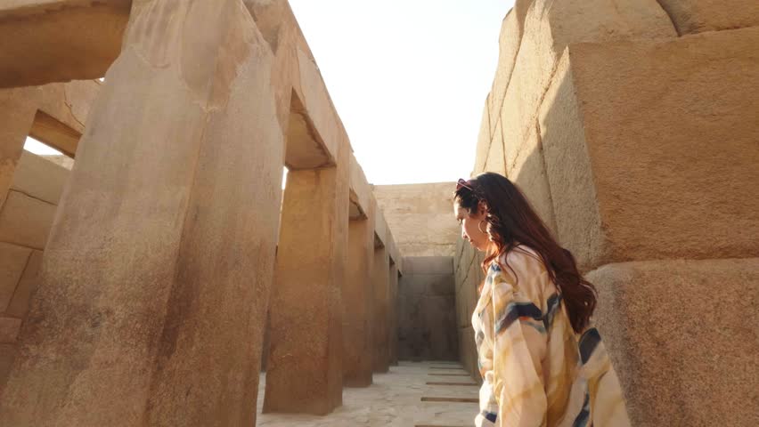 Tourist walking in ancient egyptian temple