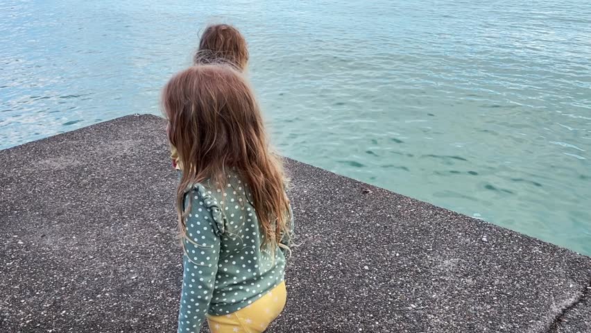 Children on the sea pier