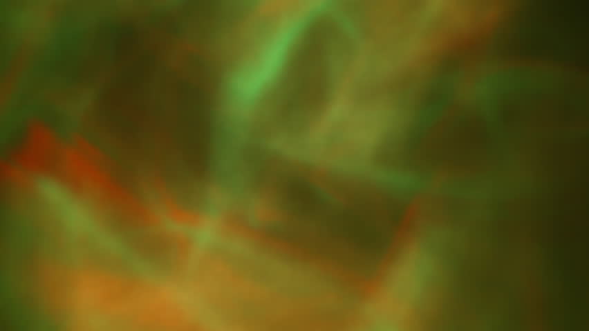 Yellow, reed and green wavy lights flowing in an abstract pattern. Background. Slow motion.