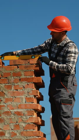 Builder Constructing a Brick Duplex Townhouse