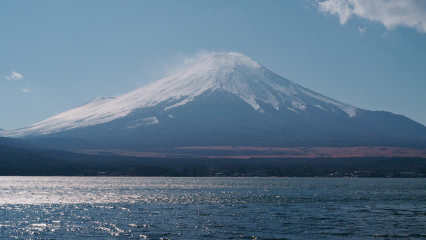4K Fuji mountain at Yamanakako Lake with tiny clouds and sky blue in Japan.
