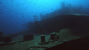 Underwater shot of the Um El Faroud Shipwreck with SCUBA Divers in Malta. - Powered by Shutterstock - Get 15% off with code: PIKWIZARD15