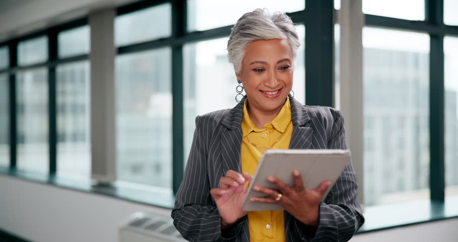 Mature business woman, tablet and reading for investment info, economy news and trading app in office. Female broker, scroll and research for stock price, market update and faq for financial advice