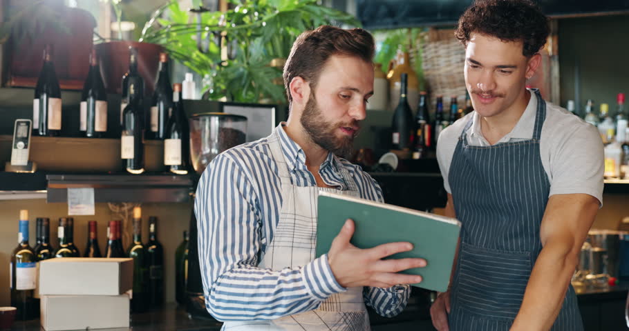 Meeting, tablet and men in coffee shop talking for planning, discussion and training in cafe. Small business, restaurant and waiter with manager on digital tech for inventory, menu and online orders
