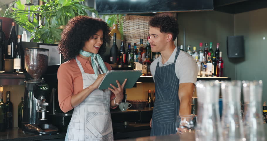 Barista, woman and man with high five at cafe, tablet or celebration for profit, sales or results. People, waiter and partnership at small business, cheers or goals for target with app at coffee shop
