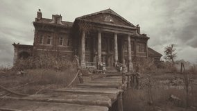 A grand but decaying mansion stands in a barren landscape, surrounded by overgrown vegetation. The sky is gray with thick clouds, creating an eerie atmosphere in the desolate setting. - Powered by Shutterstock - Get 15% off with code: PIKWIZARD15