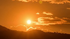 Timelapse of dramatic sunrise with orange sky in a cloudy day. - Powered by Shutterstock - Get 15% off with code: PIKWIZARD15