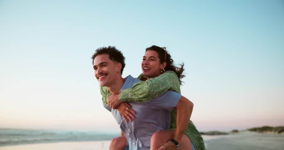 Sea, piggyback and couple on vacation, freedom and exploration in nature for romance, people or together. Outdoor, tourist and playful on date at beach, man and woman on holiday for tourism or travel