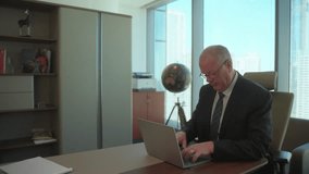 Senior executive businessman in an office finally comes up with a good idea - slow motion - Powered by Shutterstock - Get 15% off with code: PIKWIZARD15