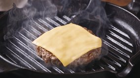 cook remove from hot grill pan fresh ground beef burger meat with cheese slice, food closeup - Powered by Shutterstock - Get 15% off with code: PIKWIZARD15