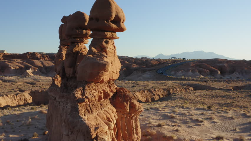 Hoodoo Pinnacles Overlooking Desert Landscape Of Goblin Valley State Park Near Hanksville In Utah. USA. closeup, orbiting drone shot