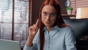 Serious confident Caucasian business woman girl female businesswoman worker lady in office with laptop computer work shake index finger no deny reject forbidden bad disagree refusal looking at camera - Powered by Shutterstock - Get 15% off with code: PIKWIZARD15