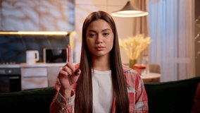 Dissatisfied Caucasian woman home owner girl in evening apartment displeased waving finger hand gesture no sign disapprove negative refusal looking at camera disagree rejection unhappy female portrait - Powered by Shutterstock - Get 15% off with code: PIKWIZARD15
