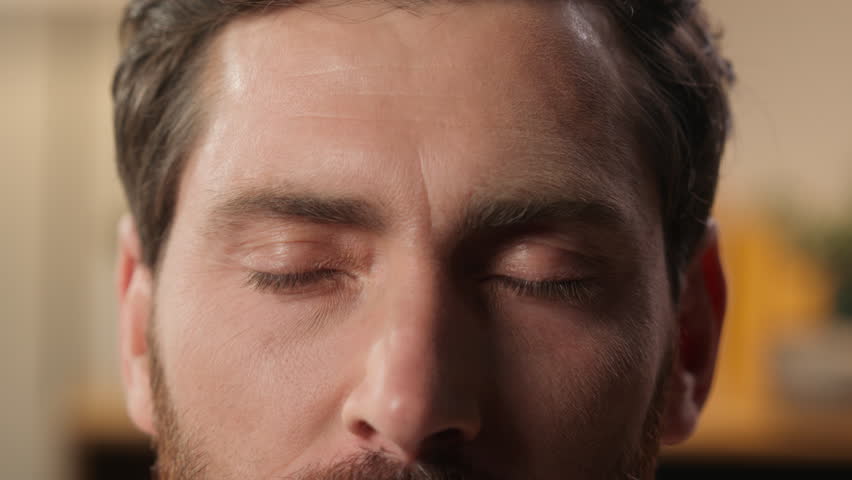 Close up human eyes Caucasian man male guy face part details open eye dark eyeball vision eyelid eyesight ophthalmology gaze millennial wrinkles middle age skin care health smiling positive emotion