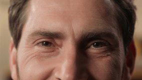 Close up human eyes Caucasian man male guy face part details open eye dark eyeball vision eyelid eyesight ophthalmology gaze millennial wrinkles middle age skin care health smiling positive emotion - Powered by Shutterstock - Get 15% off with code: PIKWIZARD15