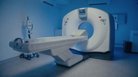 Empty MRI scanner room showing diagnostic machine with extended patient table ready for next procedure. Bright display glowing on device while scanning station remains unused and perfectly prepared. - Powered by Shutterstock - Get 15% off with code: PIKWIZARD15