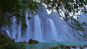 Amazing Ban Gioc Waterfall (Ban Gioc Waterfall) or in China it is called Detian Falls, which is the 4th largest waterfall in the world. Its location is on the border between Vietnam and China - Powered by Shutterstock - Get 15% off with code: PIKWIZARD15