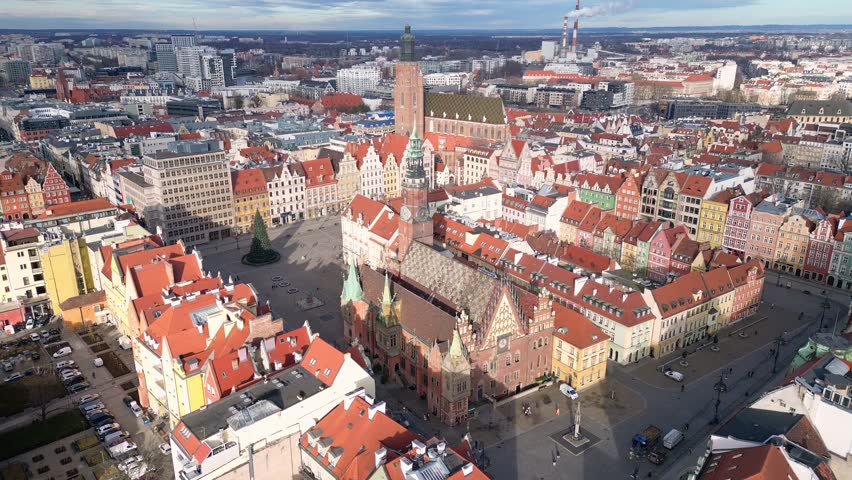 Wroclaw, Poland: Aerial orbit footage of the famous market square in Wroclaw medieval old town with the ancient town hall and St. Elizabeth