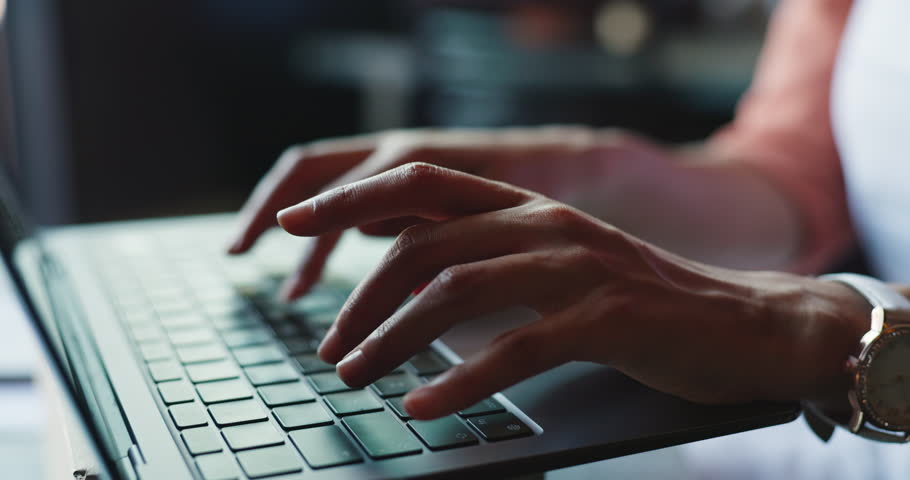 Laptop, hands and woman typing in office for copywriting, article or story for social media platform. Computer keyboard, closeup and person writing blog for review, editing and creative in startup