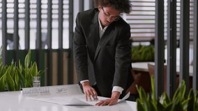 Architecture work African American man businessman business guy male working with blueprint planning engineering office construction building architect sketch corporate strategy design plan engineer - Powered by Shutterstock - Get 15% off with code: PIKWIZARD15