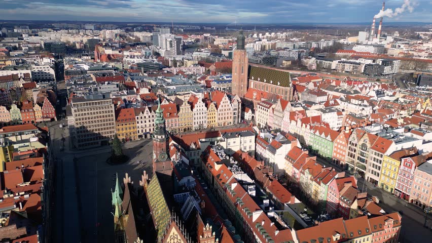 Wroclaw, Poland: Aerial orbit footage of the famous market square in Wroclaw medieval old town with the ancient town hall and St. Elizabeth