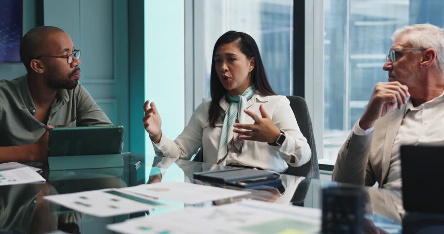 Business people, paper and meeting in office for planning, company development or financial brainstorming. Corporate team, documents or woman speaker in boardroom to explain budget or expense report