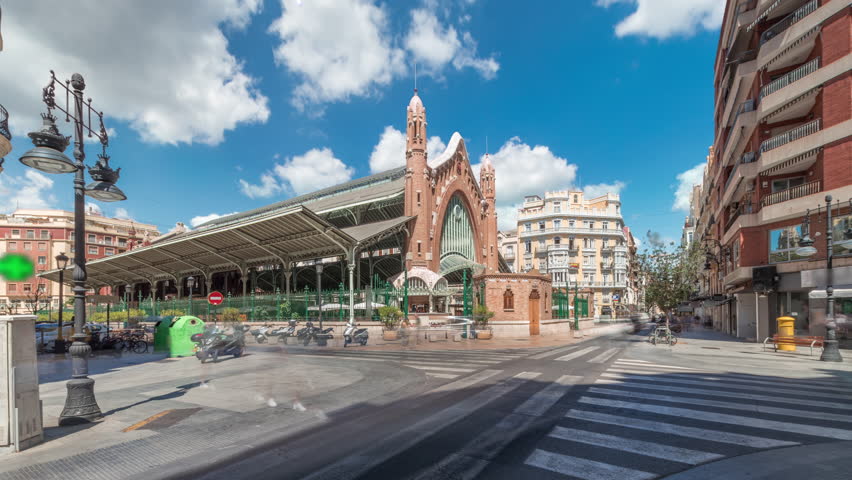Mercado de Colon timelapse hyperlapse in Valencia, Spain, showcasing stunning Art Nouveau architecture. Popular tourist attraction with shops and cafes in a beautifully restored market building.