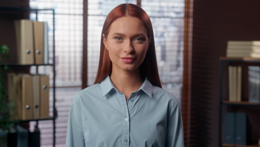 Portrait confident happy laughing emotional positive Caucasian redhead girl student business woman female worker businesswoman in office looking at camera smiling toothy healthy joke joy fun face
