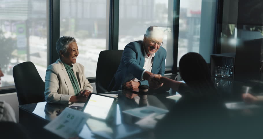 Deal, handshake and meeting with business people in boardroom of office for collaboration. Agreement, B2B and partnership with employee team in workplace together for acquisition, merger or success