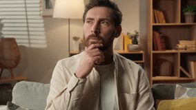 Thoughtful man thinking guy homeowner tenant at home pensive Caucasian male husband businessman think ponder choose happy joyful find idea plan answer raised finger insight gesture dream loan mortgage - Powered by Shutterstock - Get 15% off with code: PIKWIZARD15